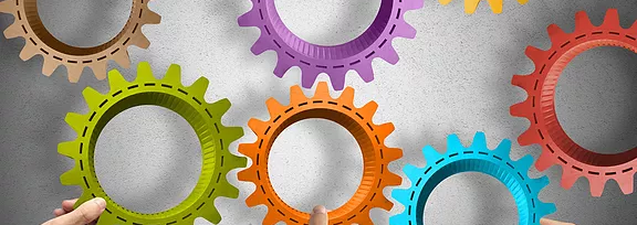 Interlocking gears representing integrated systems